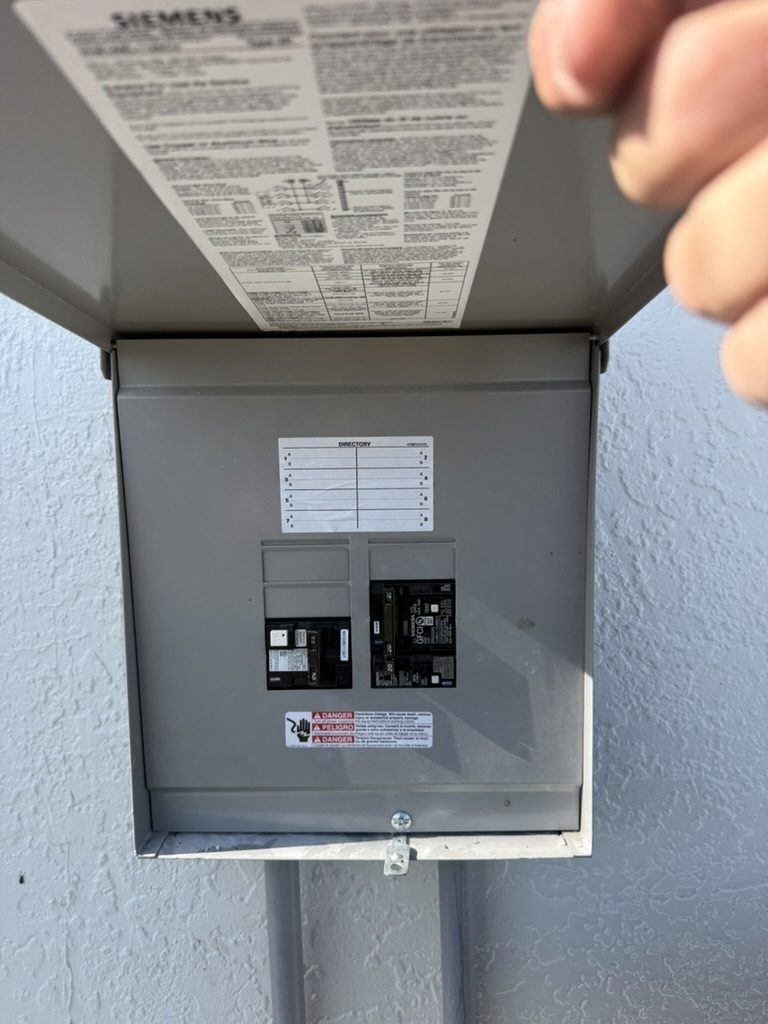 Siemens outdoor panel open, showing the breakers that feed the dock