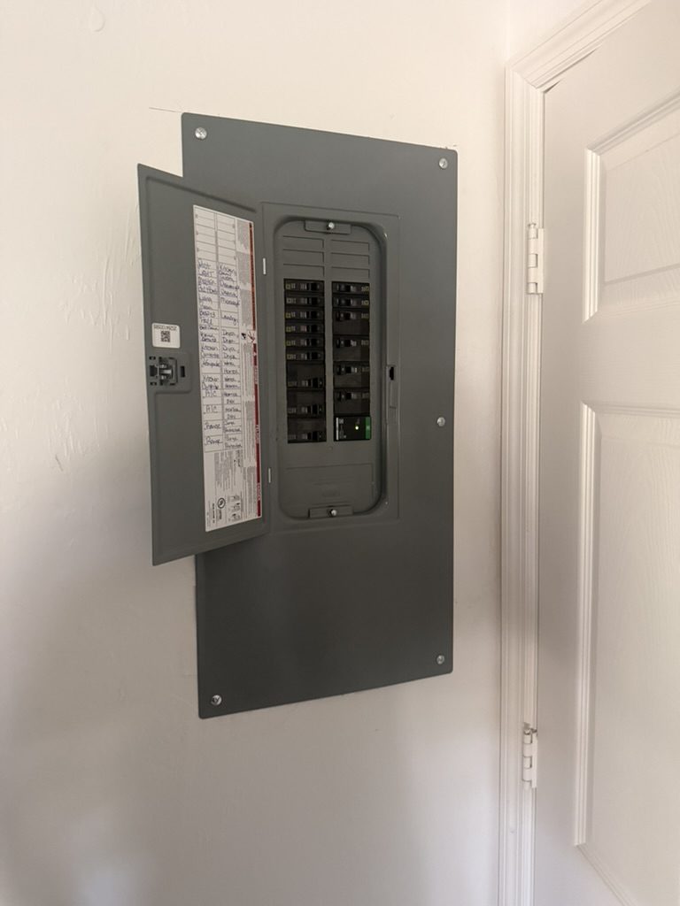 New Square D QO panel with the door open, showing the breakers and the labeled circuit directory