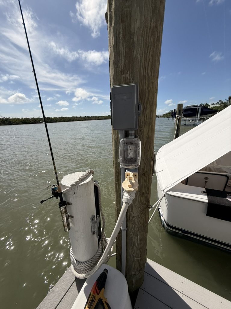 Close view of the piling, disconnect, 120-volt receptacle and shore power receptacle