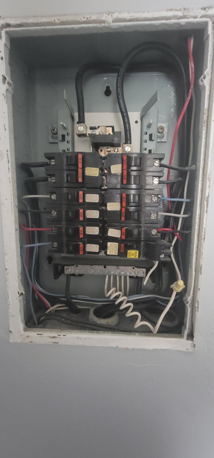 Inside a Federal Pacific Stab-Lok panel showing the original Stab-Lok breakers and wiring