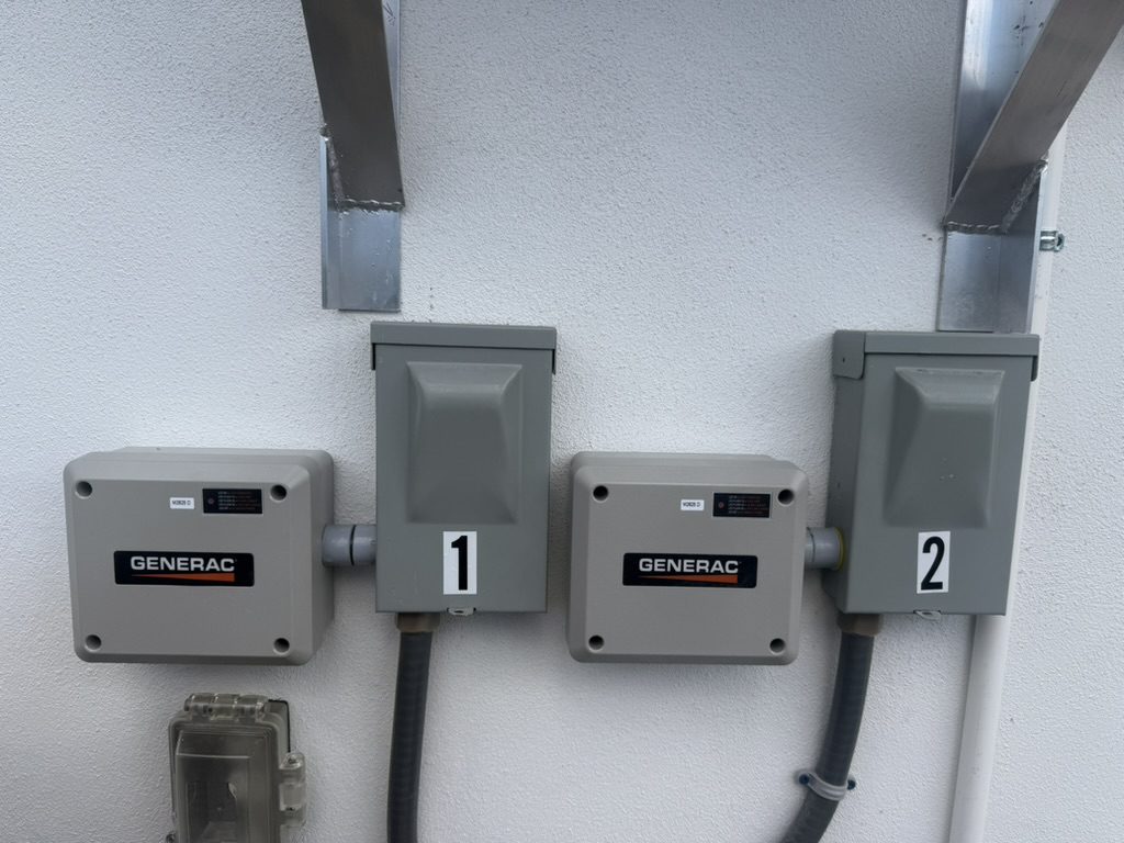 Two Generac smart modules installed at the air-conditioning disconnects