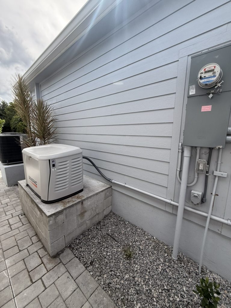 Generator on the raised concrete pad with the meter main and conduit run