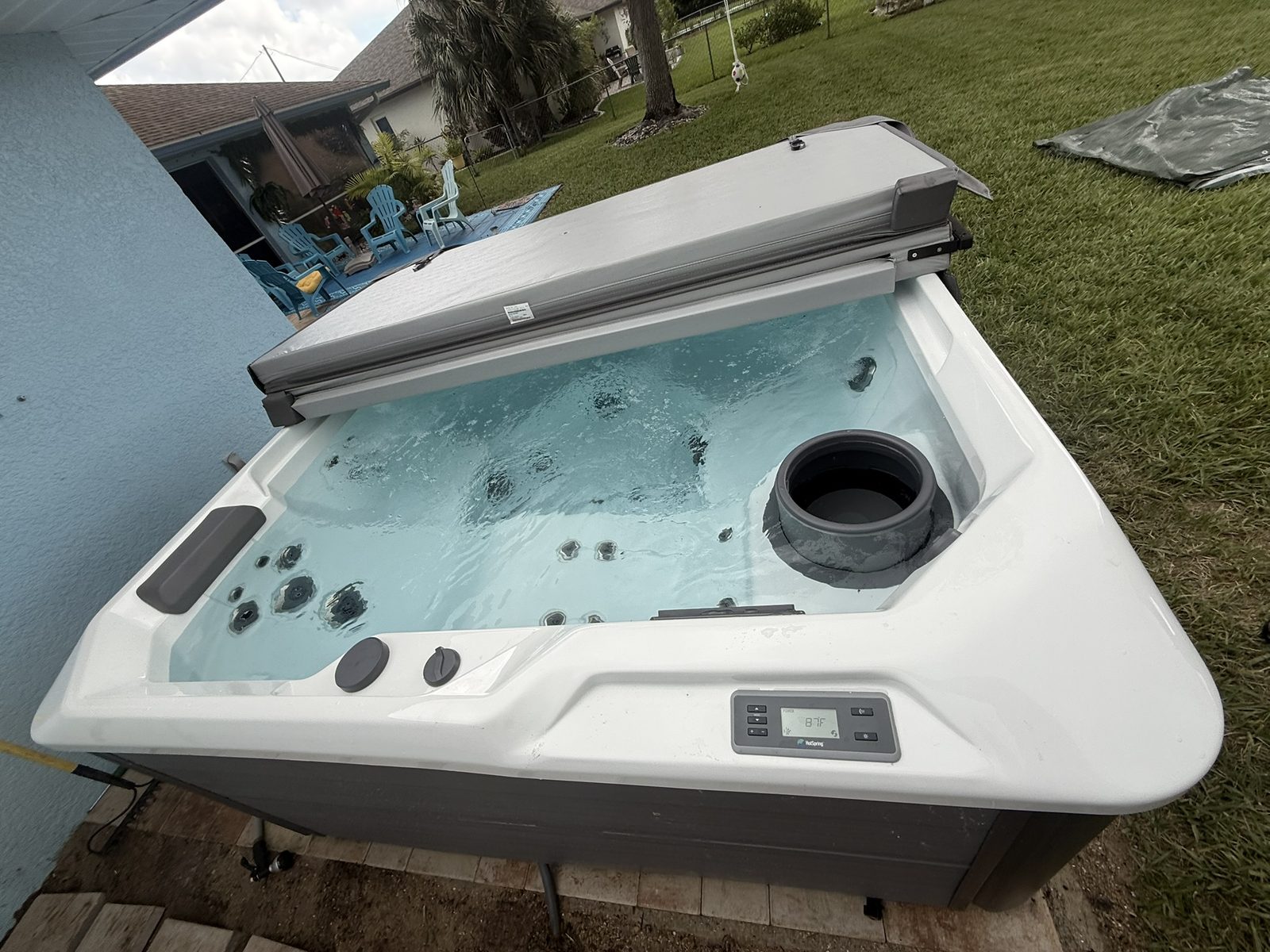 HotSpring hot tub connected and running in a Cape Coral backyard
