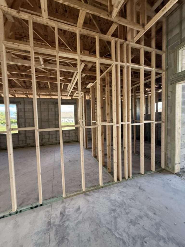Interior wall framing and concrete block walls before wiring