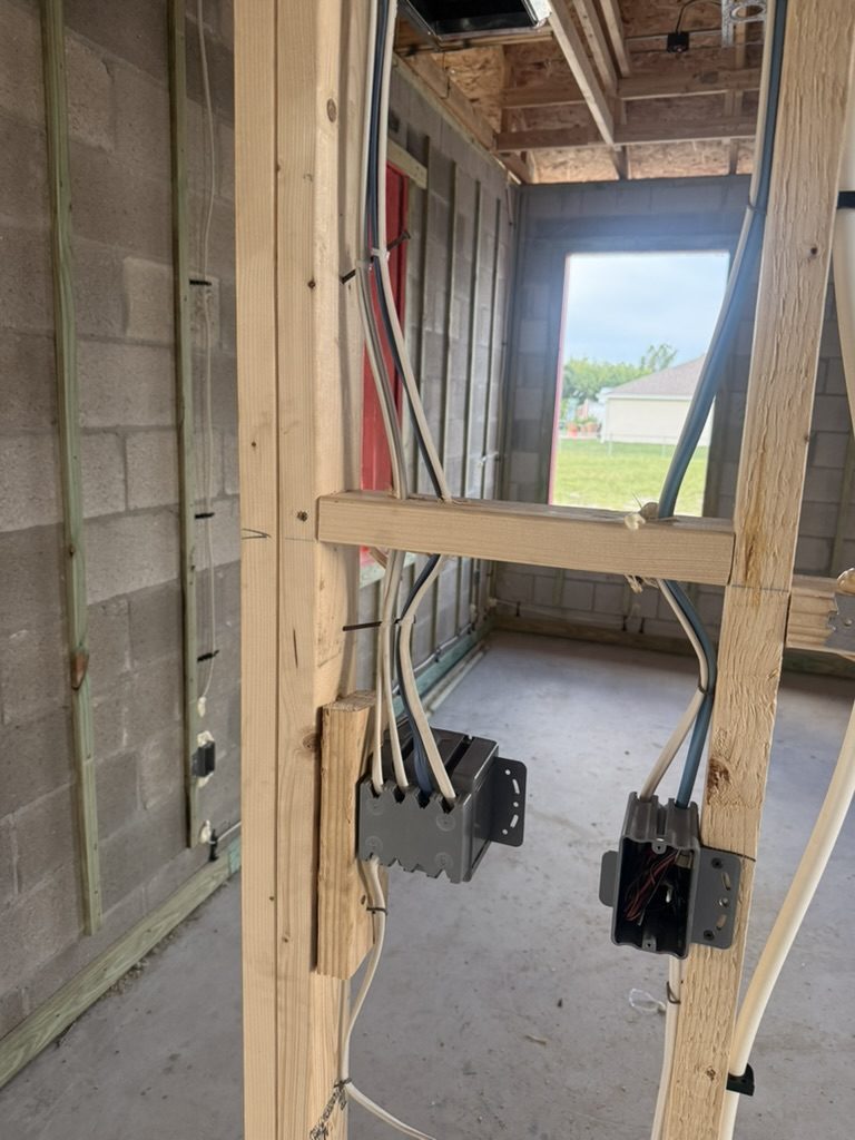 Device boxes with cables secured to the framing