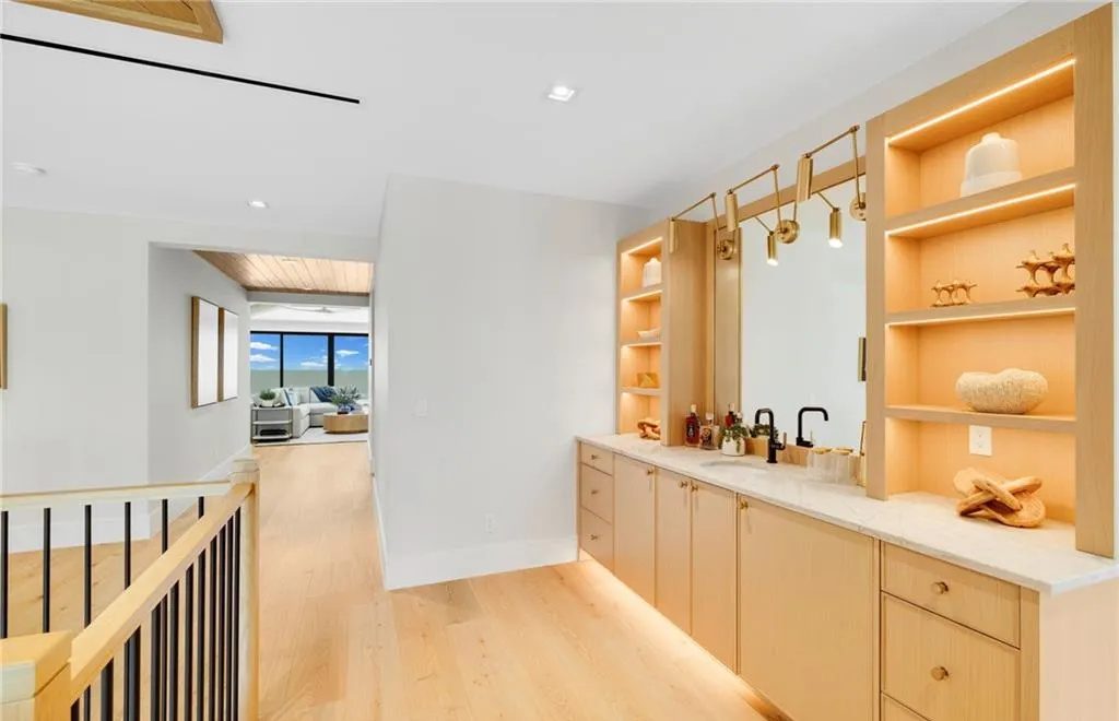 Wet bar with LED-lit shelving and toe kick lighting